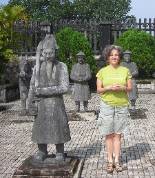 Barbara Levitov at Tomb of Khai Dinh among statues of bodyguard soldiers