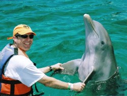 Bill Gilson dances with Athenea the Dolphin